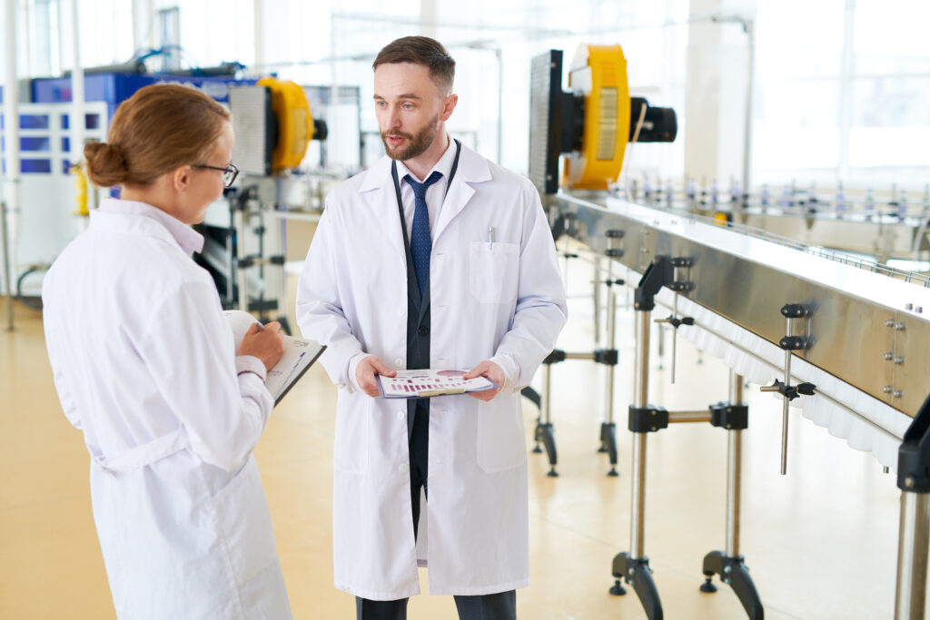 discussing-production-process-with-colleague-Q4R2NCS-1024×683